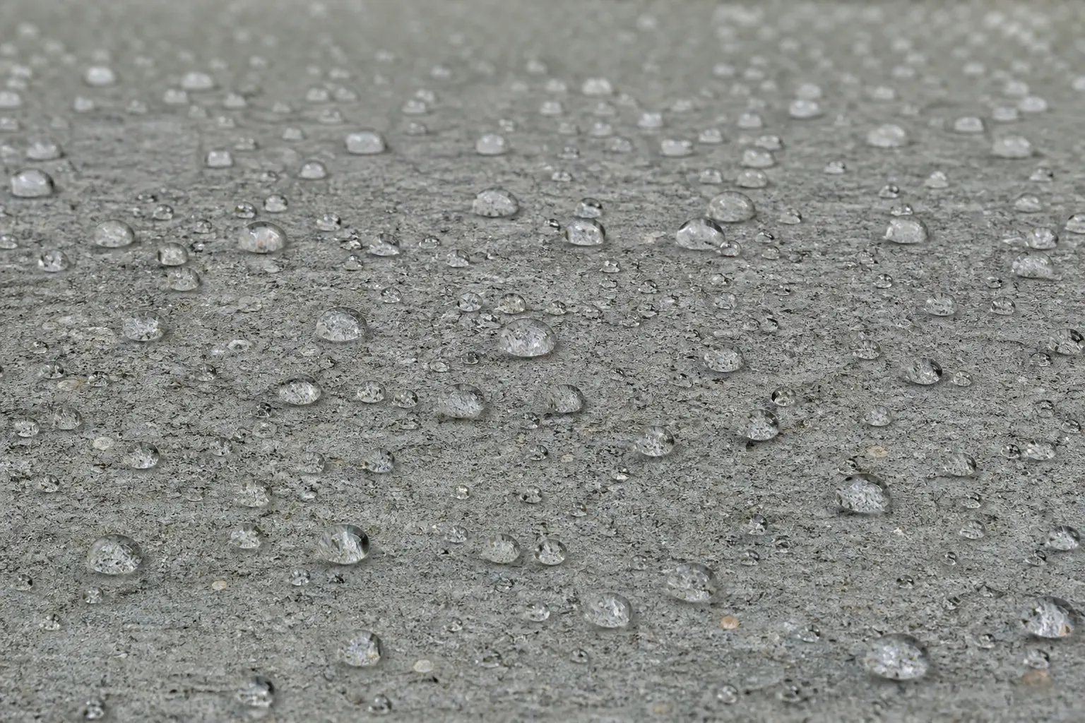 Water beading on concrete sealed with GoNano Concrete Saver